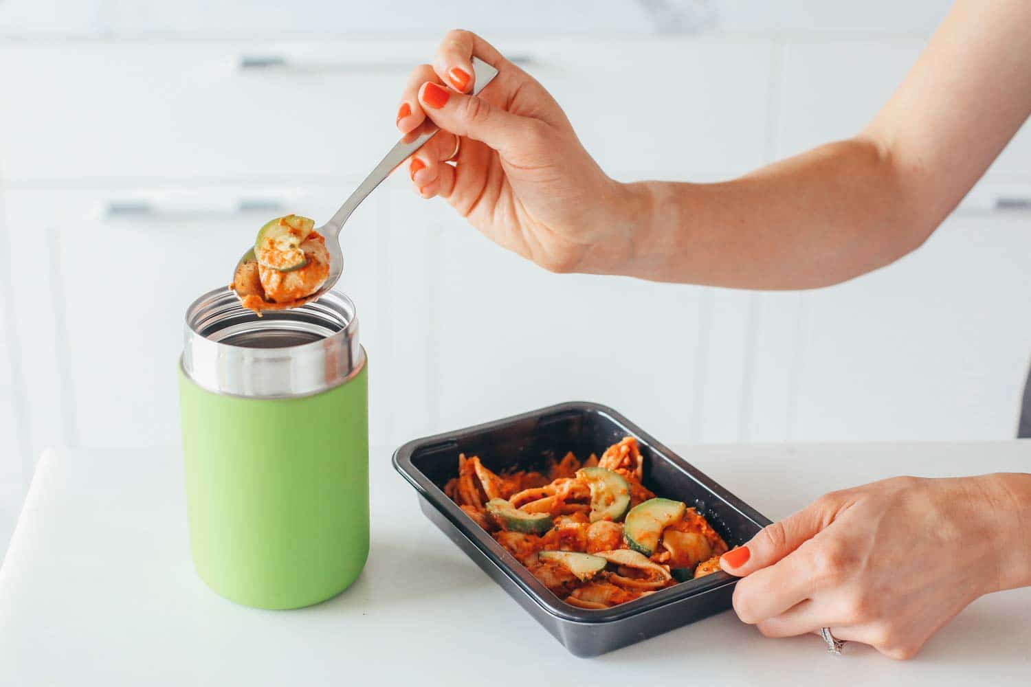 kids hot lunch being put in a thermos